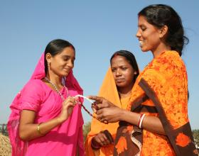 3 Indian women discussing reproductive health Source - Institute for Reproductive Health, Georgetown University